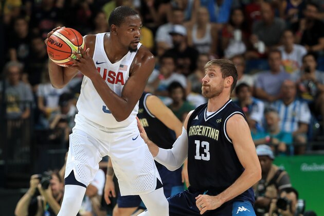 RIO DE JANEIRO, BRAZIL - AUGUST 17:  Kevin Durant #5 of United States with the ball against Andres Nocioni #13 of Argentina during the Men's Quarterfinal match on Day 12 of the Rio 2016 Olympic Games at Carioca Arena 1 on August 17, 2016 in Rio de Janeiro, Brazil.  (Photo by Sam Greenwood/Getty Images)