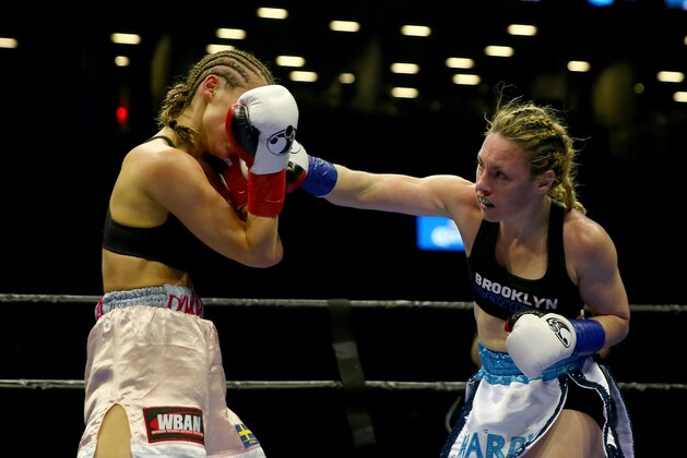 NEW YORK, NY - APRIL 16: Heather Hardy and Anna Hultin exchange punches during their featherweight bout at Barclays Center on April 16, 2016 in the Brooklyn borough of New York City. (Photo by Elsa/Getty Images) NEW YORK, NY - APRIL 16: Heather Hardy and Anna Hultin exchange punches during their featherweight bout at Barclays Center on April 16, 2016 in the Brooklyn borough of New York City. (Photo by Elsa/Getty Images)