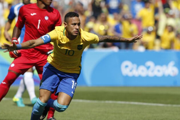 Brazil's Neymar celebrates after his side's first goal during a semifinal match of the men's Olympic football tournament against Honduras at the Maracana stadium in Rio de Janeiro, Brazil, Wednesday Aug. 17, 2016. Neymar scored just 15 seconds into the game as Brazil took an early lead over Honduras. It was the fastest goal ever scored in the men's Olympic tournament.(AP Photo/Silvia Izquierdo)
