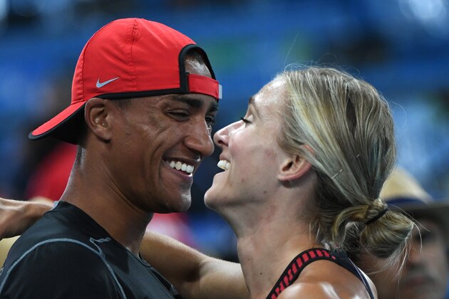 TOPSHOT - Canada's Brianne Theisen Eaton (R) celebrates with her husband US athlete Ashton Eaton after she won bronze in the Women's Heptathlon 800m during the athletics event at the Rio 2016 Olympic Games at the Olympic Stadium in Rio de Janeiro on August 13, 2016.   / AFP / OLIVIER MORIN        (Photo credit should read OLIVIER MORIN/AFP/Getty Images)
