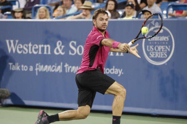 Stan Wawrinka, of Switzerland, returns to Jared Donaldson, of the United States, during the Western & Southern Open tennis tournament, Tuesday, Aug. 16, 2016, in Mason, Ohio. (AP Photo/John Minchillo)