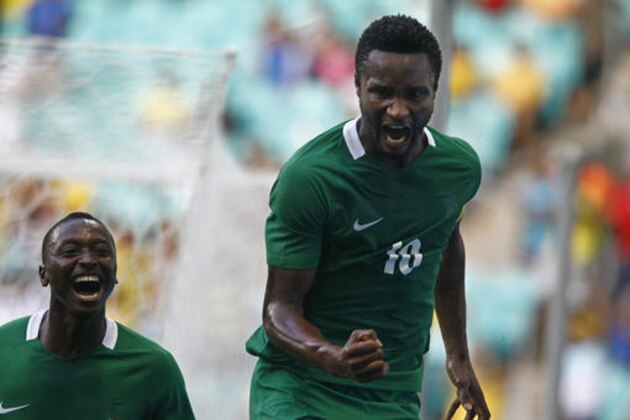 Nigeria's John Obi Mikel, right, celebrates his goal during a quarter-final match of the men's Olympic football tournament between Denmark and Nigeria at the Fonte Nova Arena in Salvador, Brazil, Saturday, Aug. 13, 2016. (AP Photo/Arisson Marinho)