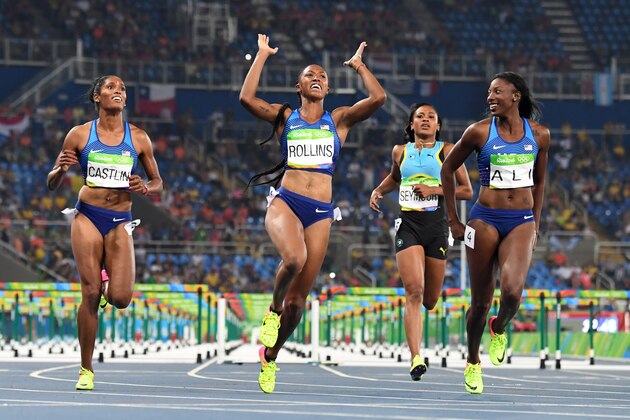Gold medallist USA's Brianna Rollins (2ndL) celebrates as she crosses the finish line ahead of silver medallist USA's Nia Ali (R) and bronze medallist USA's Kristi Castlin (L) to win the Women's 100m Hurdles Final during the athletics event at the Rio 2016 Olympic Games at the Olympic Stadium in Rio de Janeiro on August 17, 2016.   / AFP / OLIVIER MORIN        (Photo credit should read OLIVIER MORIN/AFP/Getty Images)