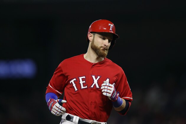 ARLINGTON, TX - AUGUST 12:  Jonathan Lucroy #25 of the Texas Rangers runs the bases after hitting a three-run homerun against the Detroit Tigers in the first inning at Globe Life Park in Arlington on August 12, 2016 in Arlington, Texas.  (Photo by Ronald Martinez/Getty Images)