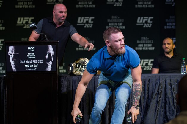 LAS VEGAS, NV - AUGUST 17:  UFC featherweight champion Conor McGregor grabs two cans during the during the UFC 202 Press Conference at David Copperfield Theater in the MGM Grand Hotel/Casino on August 17, 2016 in Las Vegas, Nevada. (Photo by Brandon Magnus/Zuffa LLC/Zuffa LLC via Getty Images)