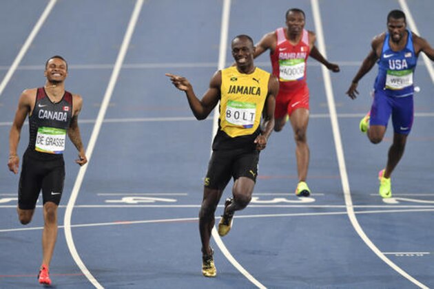 Jamaica's Usain Bolt, center left, and Canada's Andre De Grasse, left, compete in a men's 200-meter semifinal during the athletics competitions of the 2016 Summer Olympics at the Olympic stadium in Rio de Janeiro, Brazil, Wednesday, Aug. 17, 2016. (AP Photo/Martin Meissner)