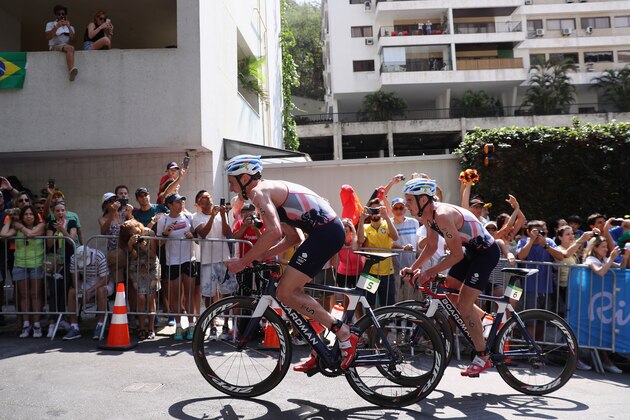 RIO DE JANEIRO, BRAZIL - AUGUST 18:  Alistair Brownlee and Jonathan Brownlee of Great Britain compete during the Men's Triathlon at Fort Copacabana on Day 13 of the 2016 Rio Olympic Games on August 18, 2016 in Rio de Janeiro, Brazil.  (Photo by Bryn Lennon/Getty Images)