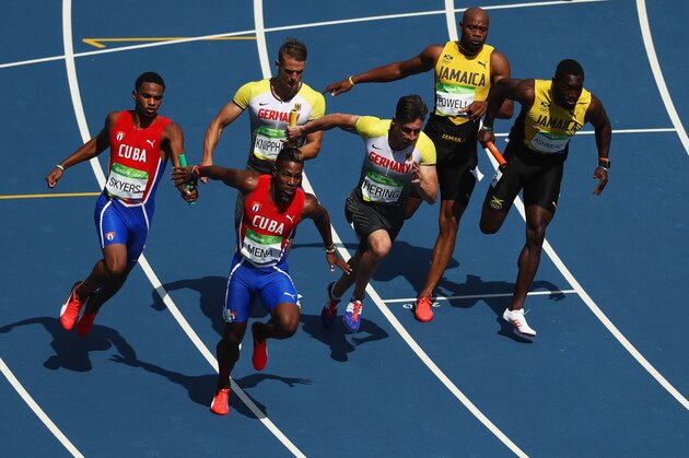 RIO DE JANEIRO, BRAZIL - AUGUST 18:  Cuba Germany and Jamaica pass batons in heat two during round one of the Men's 4 x 100m Relay on Day 13 of the Rio 2016 Olympic Games at the Olympic Stadium on August 18, 2016 in Rio de Janeiro, Brazil.  (Photo by Ezra Shaw/Getty Images)