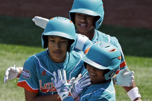 Panama's Esmith Pineda, left, celebrates with teammates Harrison Castillo, right, and Carlos Gonzalez, rear, after hitting a three run home run against Mexico during the third inning of an International pool play baseball game at the Little League World Series tournament in South Williamsport, Pa., Thursday, Aug. 18, 2016. (AP Photo/Gene J. Puskar)