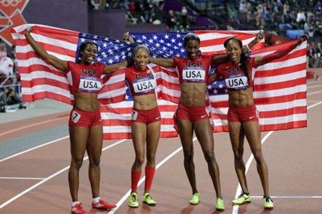 From left, United States' Francena McCorory, United States' Allyson Felix, United States' Deedee Trotter and United States' Sanya Richards-Ross celebrate winning gold in the women's 4x400-meter relay final during the athletics in the Olympic Stadium at the 2012 Summer Olympics, London, Saturday, Aug. 11, 2012. (AP Photo/David J. Phillip)