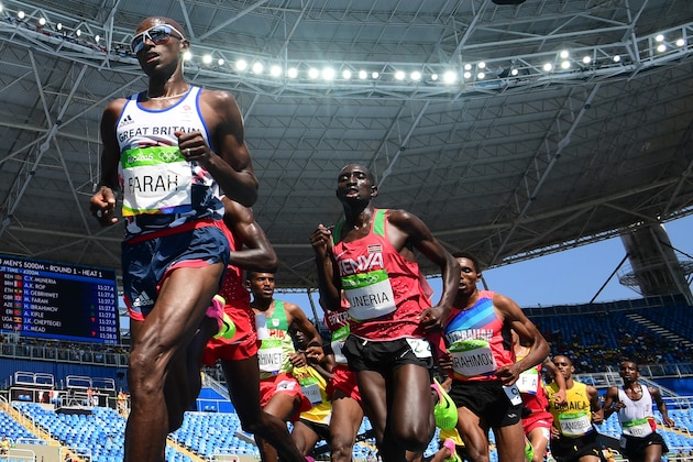 Britain's Mo Farah (L) competes in the Men's 5000m Round 1 during the athletics event at the Rio 2016 Olympic Games at the Olympic Stadium in Rio de Janeiro on August 17, 2016.   / AFP / FRANCK FIFE        (Photo credit should read FRANCK FIFE/AFP/Getty Images)