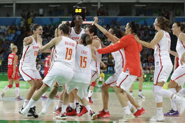 Spain players celebrate on the court after a semifinal round basketball game against Serbia at the 2016 Summer Olympics in Rio de Janeiro, Brazil, Thursday, Aug. 18, 2016. (AP Photo/Charlie Neibergall)
