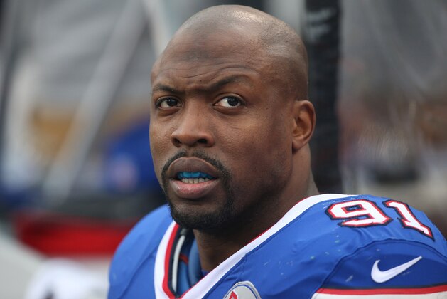 ORCHARD PARK, NY - NOVEMBER 30: Manny Lawson #91 of the Buffalo Bills looks on from the bench during NFL game action against the Cleveland Browns at Ralph Wilson Stadium on November 30, 2014 in Orchard Park, New York. (Photo by Tom Szczerbowski/Getty Images)
