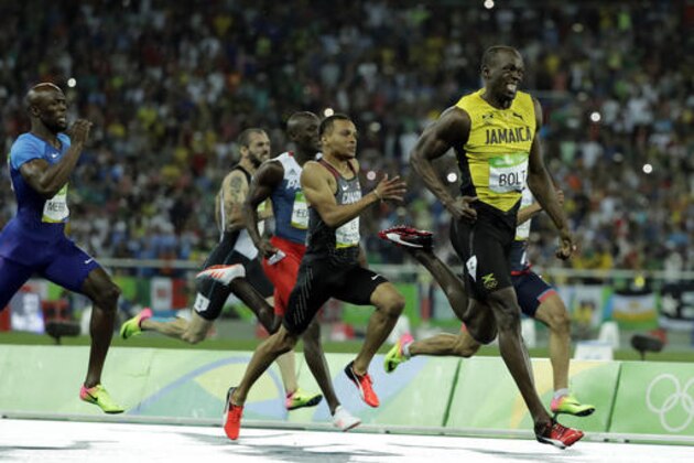 Usain Bolt from Jamaica leads to win the gold medal in the men's 200-meter final during the athletics competitions of the 2016 Summer Olympics at the Olympic stadium in Rio de Janeiro, Brazil, Thursday, Aug. 18, 2016. (AP Photo/Jae C. Hong)