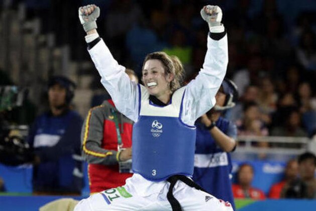 Jade Jones, of Britain, celebrates her victory over Eva Calvo Gomez, of Spain, in the women's 57-kg taekwondo gold medal match at the 2016 Summer Olympics in Rio de Janeiro, Brazil, Thursday, Aug. 18, 2016. (AP Photo/Robert F. Bukaty)