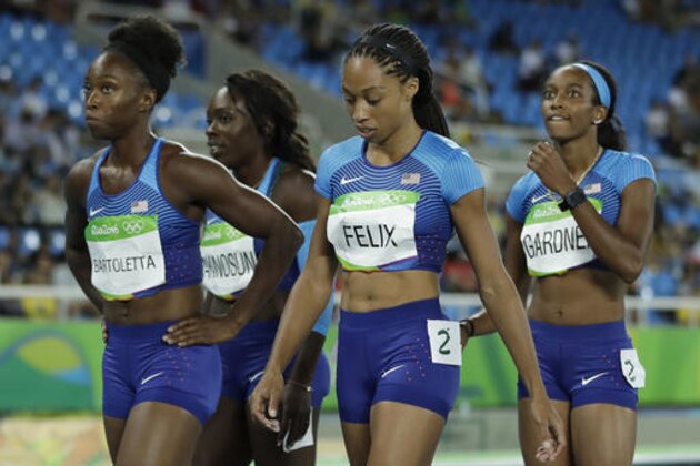 United States' Tianna Bartoletta, Morolake Akinosun, Allyson Felix and English Gardner, from left, leave the track after a women's 4x100-meter relay rerun after dropping the baton in the morning race during the athletics competitions of the 2016 Summer Olympics at the Olympic stadium in Rio de Janeiro, Brazil, Thursday, Aug. 18, 2016. (AP Photo/Matt Slocum)