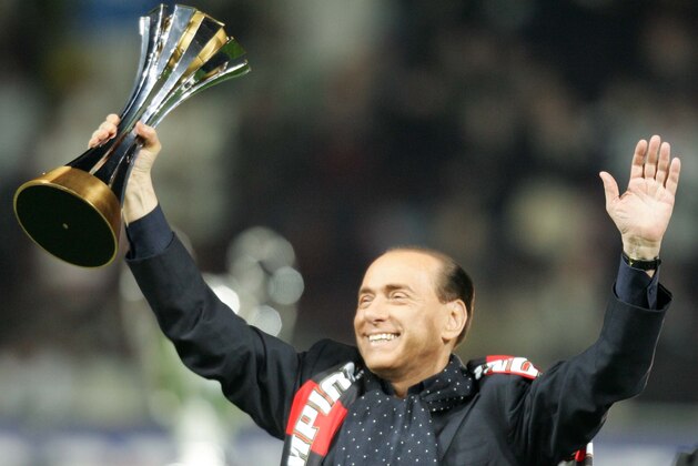 MILAN, ITALY - JANUARY 13: President of AC Milan Silvio Berlusconi holds up the FIFA Club World Cup during a ceremony prior to the Serie A match between AC Milan and Napoli at the San Siro on January 13, 2008 in Milan Italy. (Photo by Newpress/Getty Images)