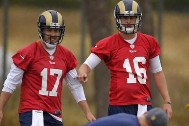 Los Angeles Rams quarterbacks Case Keenum, left, and Jared Goff talk during NFL football practice, Wednesday, June 1, 2016, in Oxnard, Calif. (AP Photo/Mark J. Terrill)