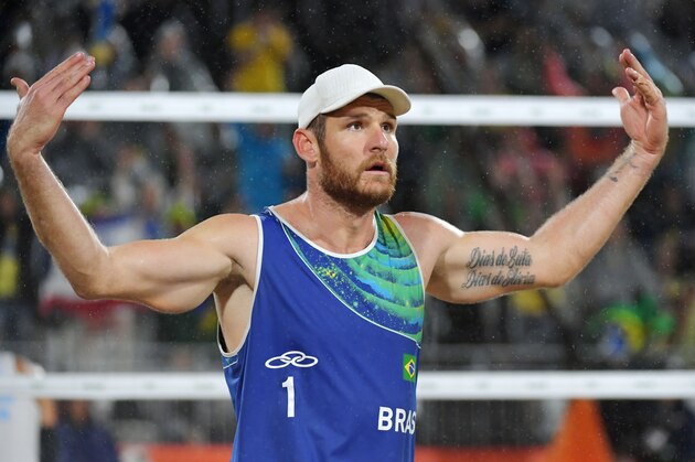 Brazil's Alison Cerutti reacts during the men's beach volleyball final match between Italy and Brazil at the Beach Volley Arena in Rio de Janeiro late on August 18, 2016, for the Rio 2016 Olympic Games. / AFP / YASUYOSHI CHIBA        (Photo credit should read YASUYOSHI CHIBA/AFP/Getty Images)