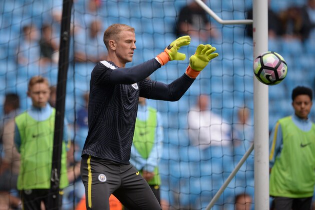 Manchester City's English goalkeeper Joe Hart warms up ahead of the English Premier League football match between Manchester City and Sunderland at the Etihad Stadium in Manchester, north west England, on August 13, 2016.
Manchester City manager Pep Guardiola dropped goalkeeper Joe Hart in favour of Willy Caballero for his opening Premier League game against Sunderland on August 13. / AFP / OLI SCARFF / RESTRICTED TO EDITORIAL USE. No use with unauthorized audio, video, data, fixture lists, club/league logos or 'live' services. Online in-match use limited to 75 images, no video emulation. No use in betting, games or single club/league/player publications.  /         (Photo credit should read OLI SCARFF/AFP/Getty Images)