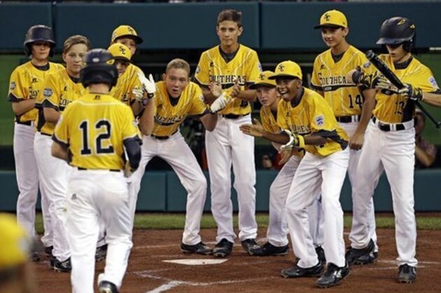 Goodlettsville, Tenn.'s Tanner Jones (12) is greeted by teammates after hitting a two-run home run off Bend, Oregon pitcher Zach Reynolds during the third inning of a baseball game in United States pool play at the Little League World Series tournament in South Williamsport, Pa., Thursday, Aug. 18, 2016. Tenn. won 3-2. (AP Photo/Gene J. Puskar)