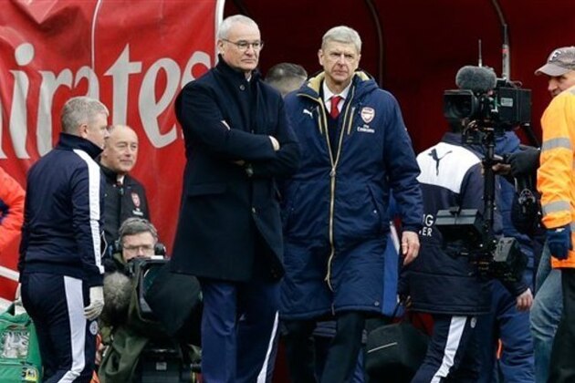 Arsenal's French manager Arsene Wenger and Leicester City's manager Claudio Ranieri, left, stand side by side at the end of the English Premier League soccer match between Arsenal and Leicester City at the Emirates Stadium in London, Sunday, Feb. 14, 2016.  Arsenal won 2-1. (AP Photo/Matt Dunham)