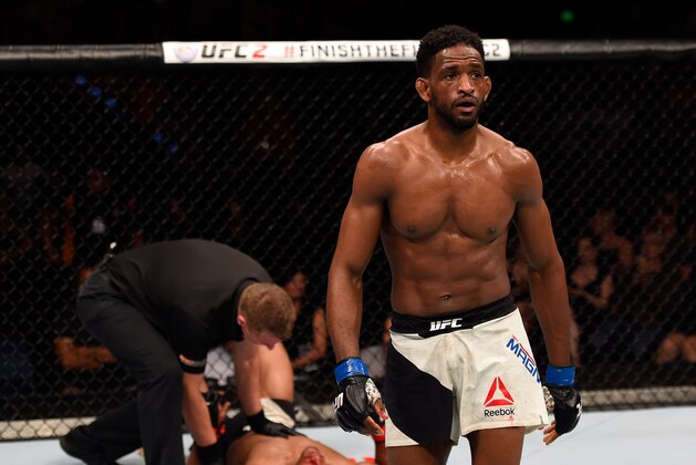 BRISBANE, AUSTRALIA - MARCH 20:  (R-L) Neil Magny of the United States walks to his corner after defeating Hector Lombard of Cuba in their welterweight bout during the UFC Fight Night event at the Brisbane Entertainment Centre on March 20, 2016 in Brisbane, Australia. (Photo by Josh Hedges/Zuffa LLC/Zuffa LLC via Getty Images)