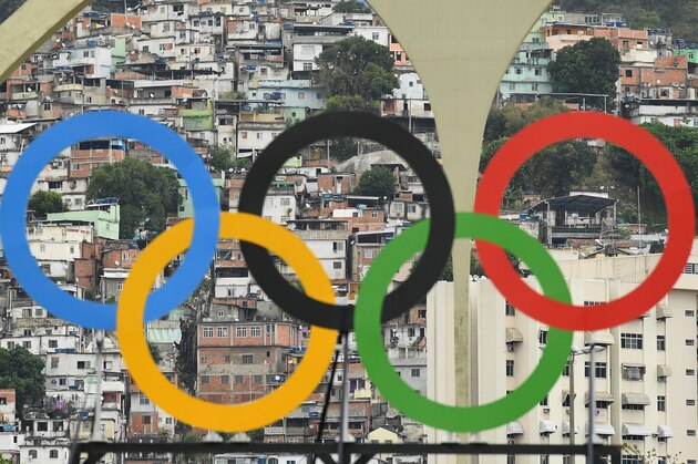 RIO DE JANEIRO, BRAZIL - AUGUST 10: Favelas are seen behind the Olympic rings on Day 5 of the Rio 2016 Olympic Games at the Sambodromo on August 10, 2016 in Rio de Janeiro, Brazil.  (Photo by Quinn Rooney/Getty Images)