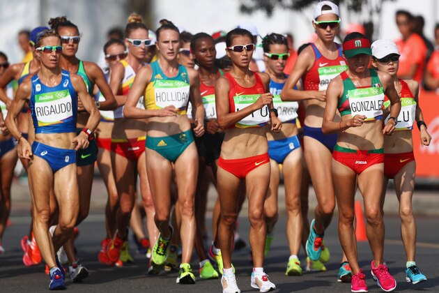 RIO DE JANEIRO, BRAZIL - AUGUST 19:  and Maria Guadalupe Gonzalez of Mexico and Hong Liu of China lead the group as they compete in the Women's 20km Walk final on Day 14 of the Rio 2016 Olympic Games at Pontal on August 19, 2016 in Rio de Janeiro, Brazil.  (Photo by Bryn Lennon/Getty Images)