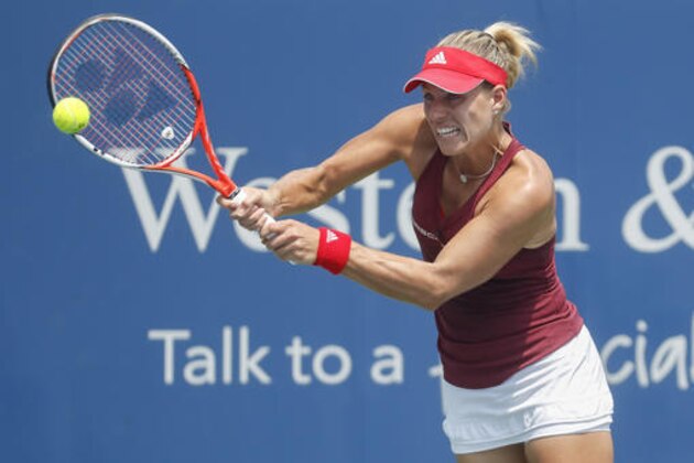 Angelique Kerber, of Germany, returns to Carla Suarez Navarro, of Spain, during the quarterfinals of the Western & Southern Open tennis tournament, Friday, Aug. 19, 2016, in Mason, Ohio. (AP Photo/John Minchillo)