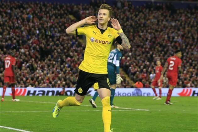 Dortmund's Marco Reus celebrates after scoring during the Europa League quarterfinal second leg soccer match between Liverpool  FC and Borussia Dortmund in Liverpool, England, Thursday, April 14, 2016 . (AP Photo/Jon Super)
