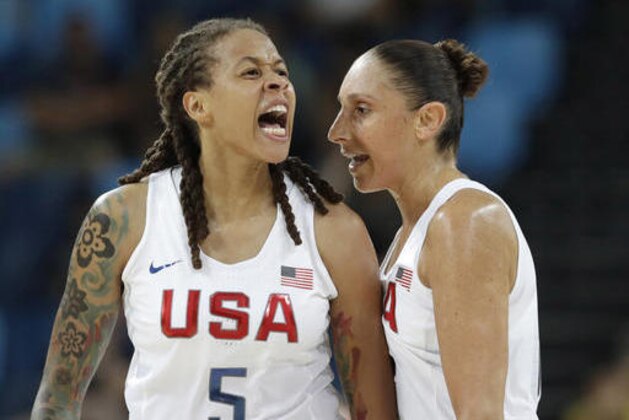 United States' Seimone Augustus (5), with teammate Diana Taurasi, reacts to a score against Japan during a women's quarterfinal round basketball game at the 2016 Summer Olympics in Rio de Janeiro, Brazil, Tuesday, Aug. 16, 2016. (AP Photo/Eric Gay)