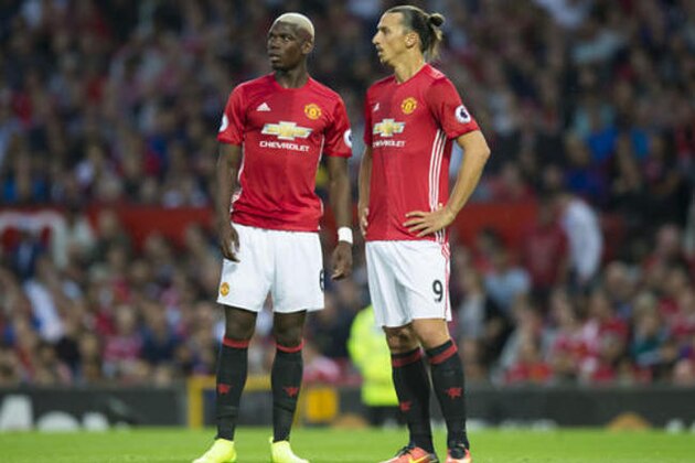 Manchester United's Zlatan Ibrahiovic, right, and Paul Pogba wait for a corner kick to be taken during the English Premier League soccer match between Manchester United and Southampton at Old Trafford Stadium, Manchester, England, Friday, Aug. 19, 2016. (AP Photo/Jon Super)