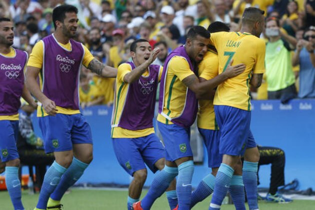Brazil's Gabriel Jesus is congratulated after scoring his side's second goal during a semi-final match of the men's Olympic football tournament between Brazil and Honduras at the Maracana stadium in Rio de Janeiro, Brazil, Wednesday Aug. 17, 2016. (AP Photo/Silvia Izquierdo)