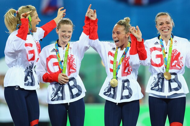 RIO DE JANEIRO, BRAZIL - AUGUST 19:  Great Britain players react with their gold medals after defeating Netherlands in the Women's Gold Medal Match on Day 14 of the Rio 2016 Olympic Games at the Olympic Hockey Centre on August 19, 2016 in Rio de Janeiro, Brazil.  (Photo by Tom Pennington/Getty Images)