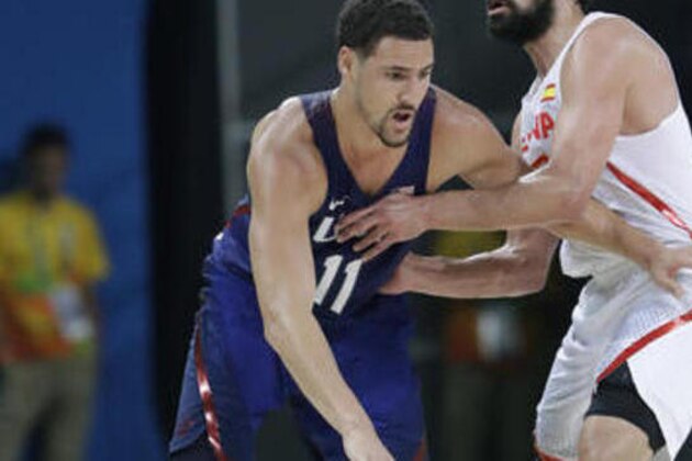United States' Klay Thompson (11) drives around Spain's Sergio Llull (23) during a men's semifinal round basketball game at the 2016 Summer Olympics in Rio de Janeiro, Brazil, Friday, Aug. 19, 2016. (AP Photo/Eric Gay)