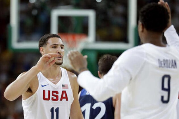 United States' Klay Thompson (11) celebrates with teammate DeMar DeRozan (9) during a basketball game against France at the 2016 Summer Olympics in Rio de Janeiro, Brazil, Sunday, Aug. 14, 2016. (AP Photo/Charlie Neibergall)