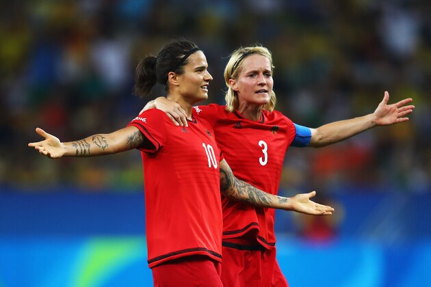RIO DE JANEIRO, BRAZIL - AUGUST 19:  Dzsenifer Marozsan of Germany and Saskia Bartusiak of Germany celebrates after going 0-2 ahead during the Women's Olympic Gold Medal match between Sweden and Germany at Maracana Stadium on August 19, 2016 in Rio de Janeiro, Brazil.  (Photo by Clive Brunskill/Getty Images)