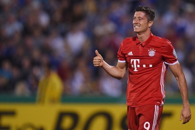 Bayern Munich's Polish striker Robert Lewandowski reacts during the German Cup (DFB Pokal) first round football match between the German first division team Bayern Munich and the German regional soccer team Carl Zeiss Jena at the stadium in Jena, eastern Germany, on August 19, 2016. / AFP / CHRISTOF STACHE / RESTRICTIONS: ACCORDING TO DFB RULES IMAGE SEQUENCES TO SIMULATE VIDEO IS NOT ALLOWED DURING MATCH TIME. MOBILE (MMS) USE IS NOT ALLOWED DURING AND FOR FURTHER TWO HOURS AFTER THE MATCH. == RESTRICTED TO EDITORIAL USE == FOR MORE INFORMATION CONTACT DFB DIRECTLY AT +49 69 67880
/ (Photo credit should read CHRISTOF STACHE/AFP/Getty Images) Bayern Munich's Polish striker Robert Lewandowski reacts during the German Cup (DFB Pokal) first round football match between the German first division team Bayern Munich and the German regional soccer team Carl Zeiss Jena at the stadium in Jena, eastern Germany, on August 19, 2016. / AFP / CHRISTOF STACHE / RESTRICTIONS: ACCORDING TO DFB RULES IMAGE SEQUENCES TO SIMULATE VIDEO IS NOT ALLOWED DURING MATCH TIME. MOBILE (MMS) USE IS NOT ALLOWED DURING AND FOR FURTHER TWO HOURS AFTER THE MATCH. == RESTRICTED TO EDITORIAL USE == FOR MORE INFORMATION CONTACT DFB DIRECTLY AT +49 69 67880
/ (Photo credit should read CHRISTOF STACHE/AFP/Getty Images)