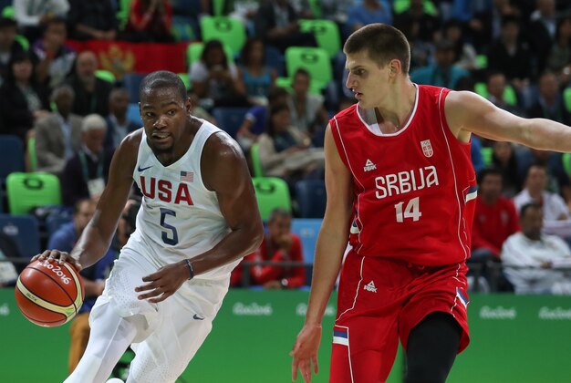 Aug 12, 2016; Rio de Janeiro, Brazil; Serbia center Nikola Jokic (14) guards United States forward Kevin Durant (5) during the game in the preliminary round of the Rio 2016 Summer Olympic Games at Carioca Arena 1. Mandatory Credit: Jason Getz-USA TODAY Sports