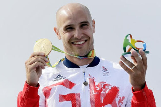 Britain's Liam Heath celebrates his gold medal in the men's kayak single 200m final during the 2016 Summer Olympics in Rio de Janeiro, Brazil, Saturday, Aug. 20, 2016. (AP Photo/Matt York)