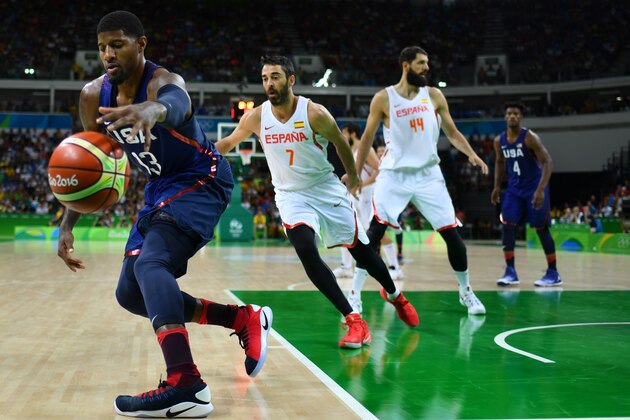 USA's guard Paul George (L) controls the ball during a Men's semifinal basketball match between Spain and USA at the Carioca Arena 1 in Rio de Janeiro on August 19, 2016 during the Rio 2016 Olympic Games. / AFP / Andrej ISAKOVIC        (Photo credit should read ANDREJ ISAKOVIC/AFP/Getty Images)