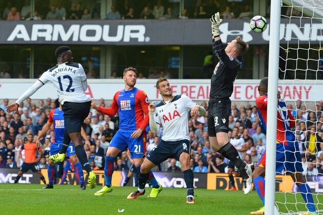 Tottenham Hotspur's Kenyan midfielder Victor Wanyama (L) heads the opening goal past Crystal Palace's Welsh goalkeeper Wayne Hennessey during the English Premier League football match between Tottenham Hotspur and Crystal Palace at White Hart Lane in London, on August 20, 2016. / AFP / Glyn KIRK / RESTRICTED TO EDITORIAL USE. No use with unauthorized audio, video, data, fixture lists, club/league logos or 'live' services. Online in-match use limited to 75 images, no video emulation. No use in betting, games or single club/league/player publications.  /         (Photo credit should read GLYN KIRK/AFP/Getty Images)