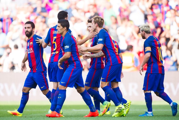 BARCELONA, SPAIN - AUGUST 20: (L-R) Arda Turan, Sergio Busquets, Luis Suarez, Denis Suarez, Ivan Rakitic and Lionel Messi of FC Barcelona celebrate after Arda Turan scored the opening goal during the La Liga match between FC Barcelona and Real Betis Balompie at Camp Nou on August 20, 2016 in Barcelona, Spain. (Photo by Alex Caparros/Getty Images)