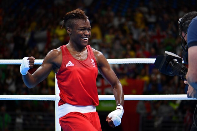Great Britain's Nicola Adams (red) celebrates winning against France's Sarah Ourahmoune (blue) during the Women's Fly (48-51kg) Final Bout at the Rio 2016 Olympic Games at the Riocentro - Pavilion 6 in Rio de Janeiro on August 20, 2016.   / AFP / Yuri CORTEZ        (Photo credit should read YURI CORTEZ/AFP/Getty Images)
