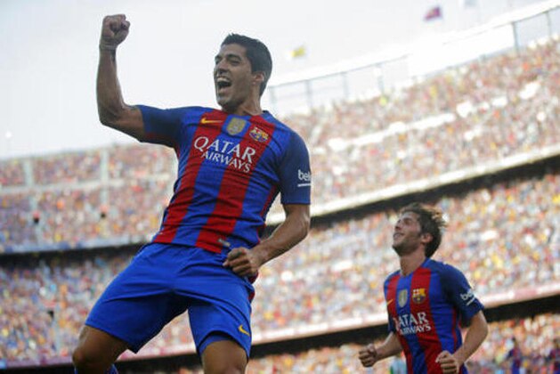 FC Barcelona's Luis Suarez celebrates after scoring during the Spanish La Liga soccer match between FC Barcelona and Betis at the Camp Nou in Barcelona, Spain, Saturday, Aug. 20, 2016. (AP Photo/Manu Fernandez) FC Barcelona's Luis Suarez celebrates after scoring during the Spanish La Liga soccer match between FC Barcelona and Betis at the Camp Nou in Barcelona, Spain, Saturday, Aug. 20, 2016. (AP Photo/Manu Fernandez)