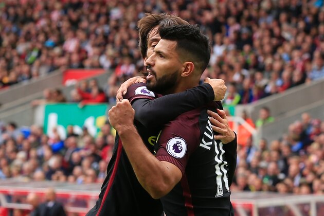 Manchester City's Argentinian striker Sergio Aguero celebrates with Manchester City's Spanish midfielder David Silva (L) after scoring the opening goal from the penalty spot during the English Premier League football match between Stoke City and Manchester City at the Bet365 Stadium in Stoke-on-Trent, central England on August 20, 2016. / AFP / Lindsey PARNABY / RESTRICTED TO EDITORIAL USE. No use with unauthorized audio, video, data, fixture lists, club/league logos or 'live' services. Online in-match use limited to 75 images, no video emulation. No use in betting, games or single club/league/player publications.  /         (Photo credit should read LINDSEY PARNABY/AFP/Getty Images)