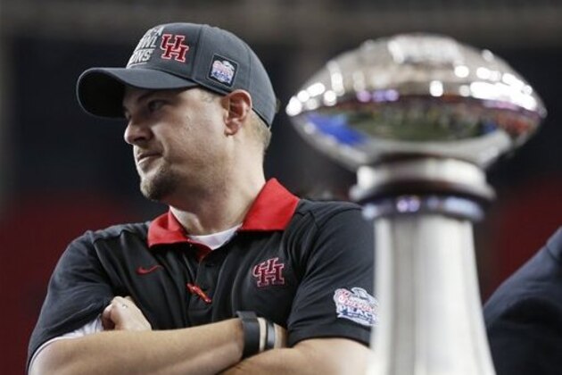 Houston head coach Tom Herman stands on the stand after the Peach Bowl NCAA college football gameagainst Florida State, Thursday, Dec. 31, 2015, in Atlanta. Houston won 38-24. (AP Photo/John Bazemore)