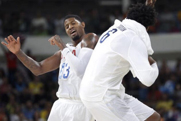 United States' Paul George (13) and United States' DeAndre Jordan (6) celebrate a score during a men's basketball game against Venezuela at the 2016 Summer Olympics in Rio de Janeiro, Brazil, Monday, Aug. 8, 2016. (AP Photo/Eric Gay)