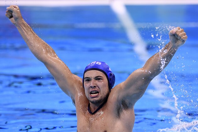 Serbia's Dusan Mandic celebrates after defeating Croatia in the Rio 2016 Olympic Games water polo final match on August 20, 2016 at the Olympic Aquatics Stadium in Rio de Janeiro, Brazil.   / AFP / GABRIEL BOUYS        (Photo credit should read GABRIEL BOUYS/AFP/Getty Images)